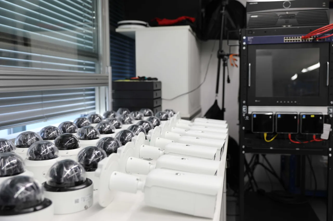 Dome and bullet cameras lined up for testing in the Arclap workshop – Arclap construction camera